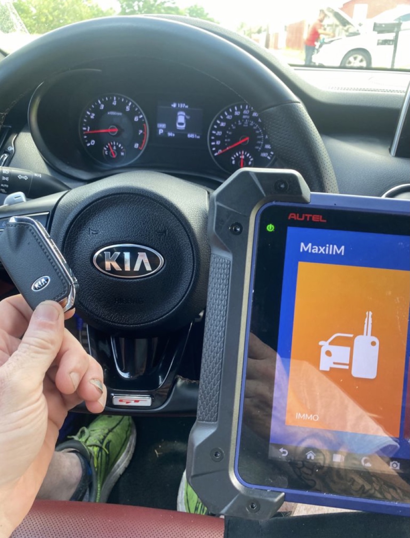 Automotive locksmith programming a vehicle key