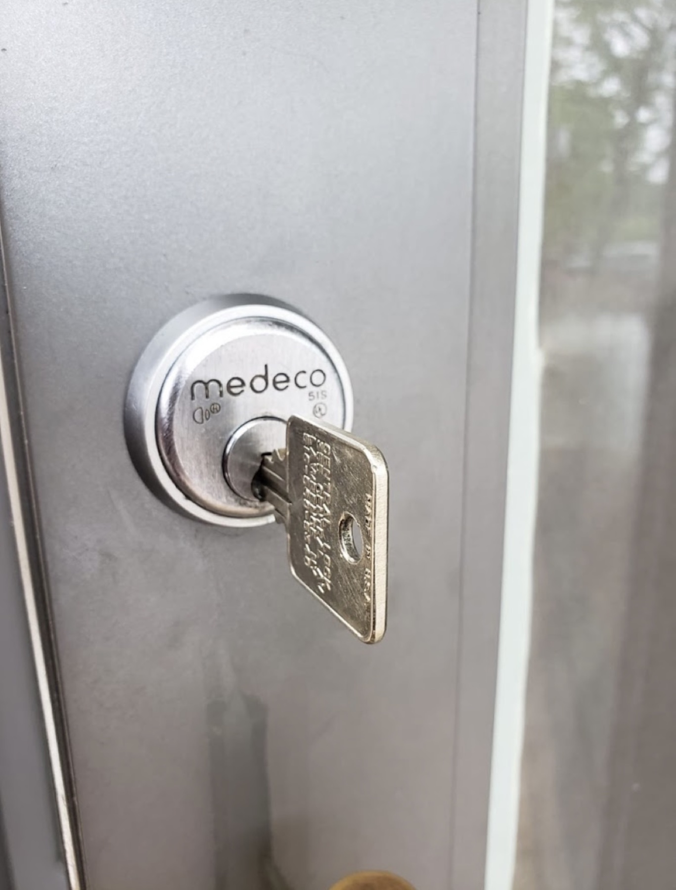 Commercial Medeco cylinder and key