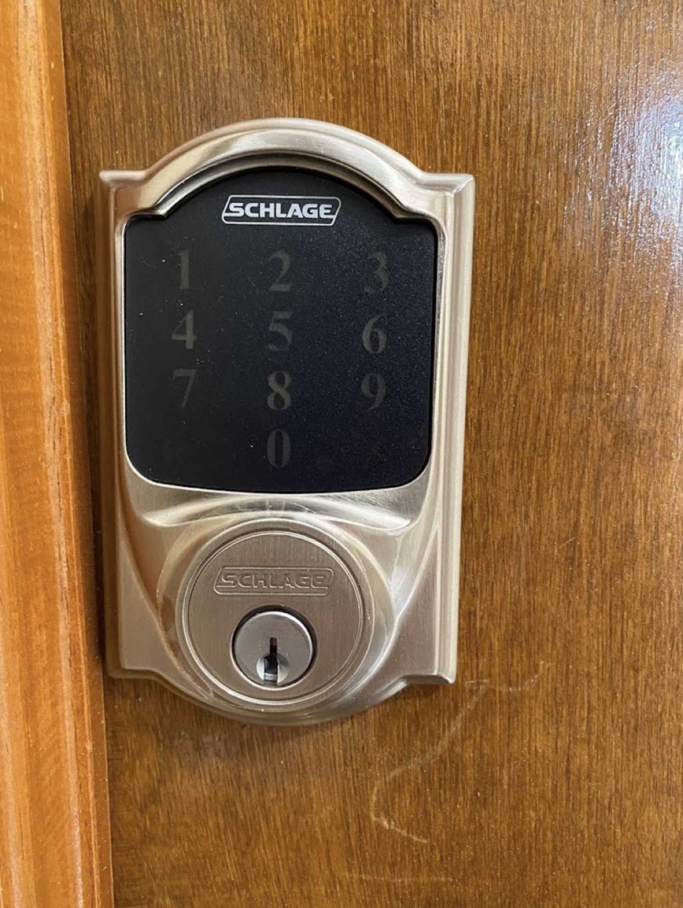 Electronic keypad deadbolt on a home entry door